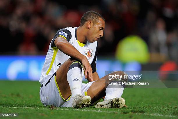 Anton Ferdinand of Sunderland shows his dejection after he scored an own goal during the Barclays Premier League match between Manchester United and...