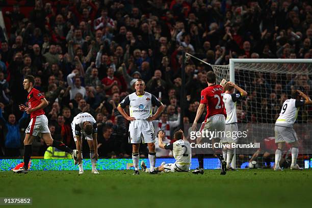 Lee Cattermole of Sunderland and Jordan Henderson show their dejection after Anton Ferdinand scored an own goal during the Barclays Premier League...