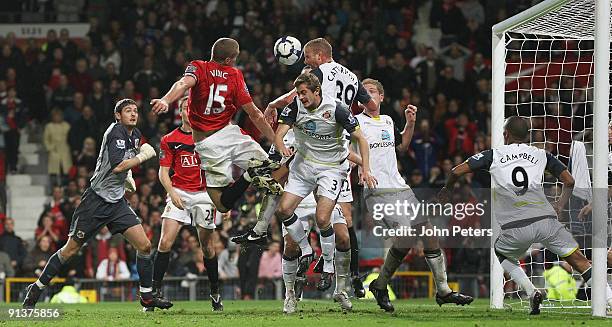 Nemanja Vidic of Manchester United clashes with Lee Cattermole of Sunderland during the FA Barclays Premier League match between Manchester United...