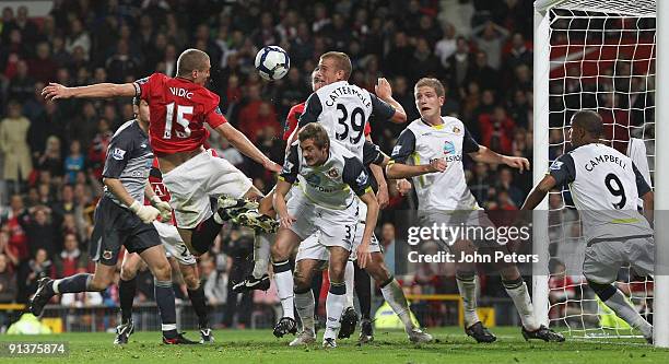 Nemanja Vidic of Manchester United clashes with Lee Cattermole of Sunderland during the FA Barclays Premier League match between Manchester United...