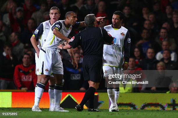 Anton Ferdinand protests as Referee Alan Wiley sends off Kieran Richardson of Sunderland during the Barclays Premier League match between Manchester...
