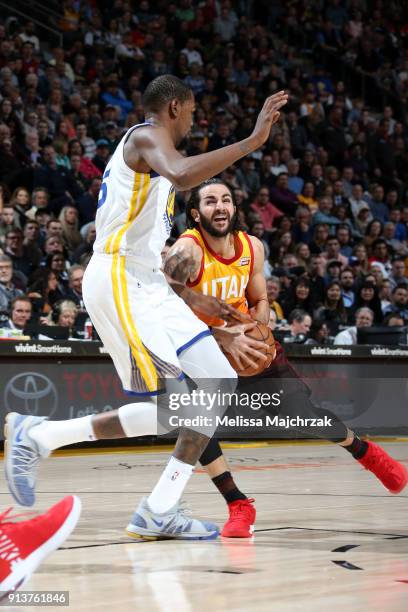 Ricky Rubio of the Utah Jazz handles the ball against Kevin Durant of the Golden State Warriors during the game between the two teams at...