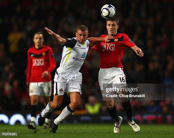 Lee Cattermole of Sunderland battles for the ball with Michael Carrick of Manchester United during the Barclays Premier League match between...