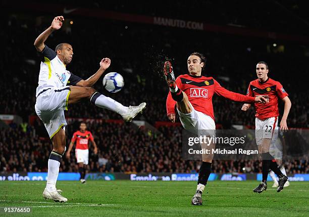 Dimitar Berbatov of Manchester United competes for the ball with Anton Ferdinand of Sunderland during the Barclays Premier League match between...