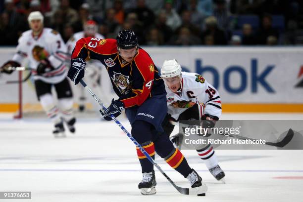 Dmitry Kulikov of the Florida Panthers breaks away from Jonathan Toews of the Chicago Blackhawks during The Compuware/NHL Premiere Helsinki series...