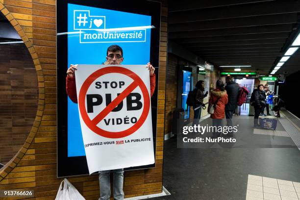 Happening against digital screen advertising in the subway of Lyon, France, on February 3, 2018. About twenty people gathered in front of the bright...