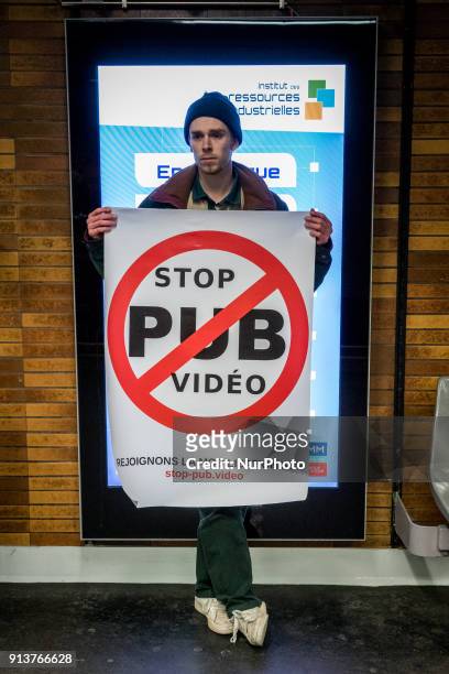 Happening against digital screen advertising in the subway of Lyon, France, on February 3, 2018. About twenty people gathered in front of the bright...