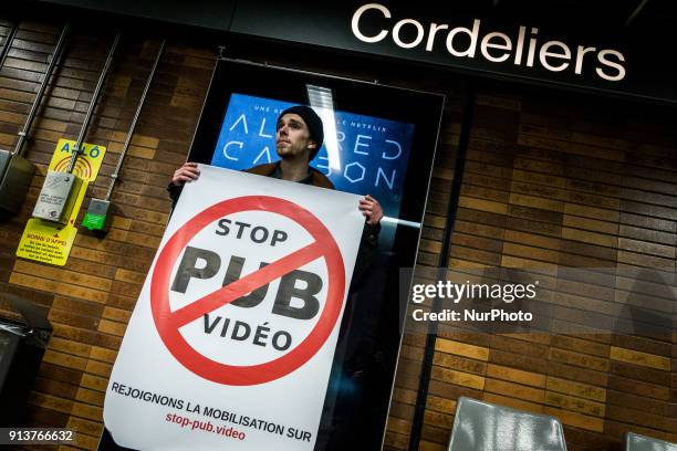 Happening against digital screen advertising in the subway of Lyon, France, on February 3, 2018. About twenty people gathered in front of the bright...