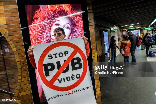 Happening against digital screen advertising in the subway of Lyon, France, on February 3, 2018. About twenty people gathered in front of the bright...