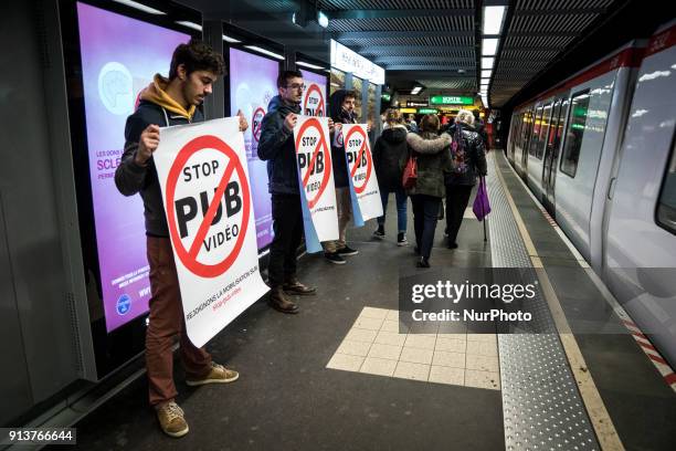 Happening against digital screen advertising in the subway of Lyon, France, on February 3, 2018. About twenty people gathered in front of the bright...