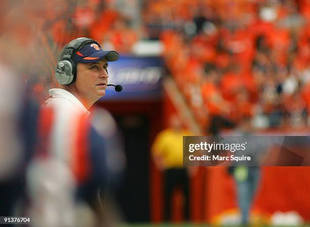 Coach Doug Marrone of the Syracuse Orange talks to his team during the game against the South Florida Bulls at the Carrier Dome on October 3, 2009 in...