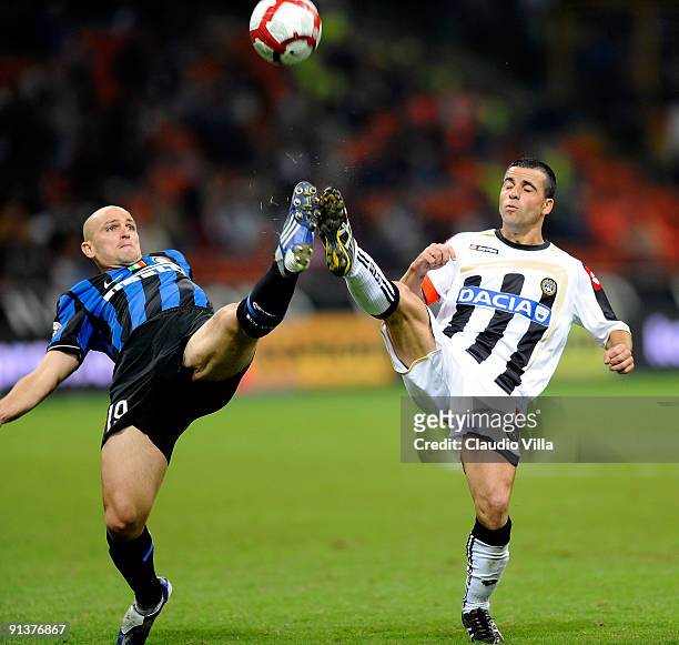 Esteban Cambiasso of FC Inter competes for the ball with Antonio Di Natale of Udinese Calcio during the Serie A match between FC Internazionale...