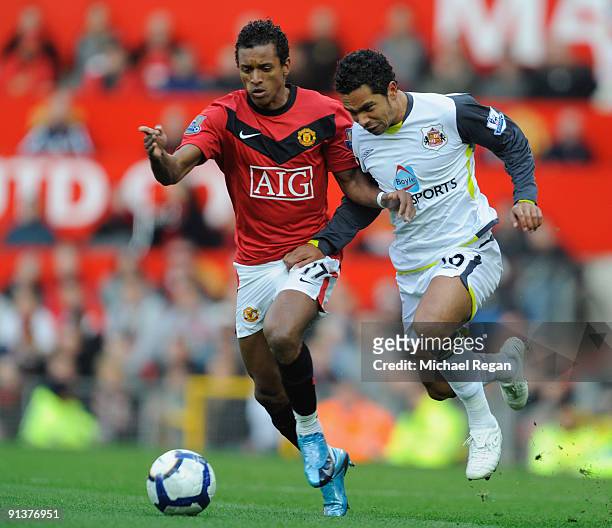 Kieran Richardson of Sunderland battles for the ball with Nani of Manchester United during the Barclays Premier League match between Manchester...