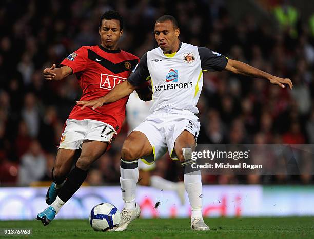 Anton Ferdinand of Sunderland competes for the ball with Nani of Manchester United during the Barclays Premier League match between Manchester United...