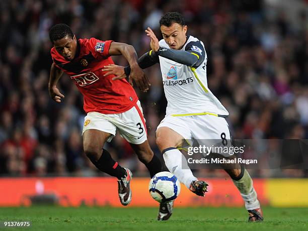 Steed Malbranque of Sunderland competes for the ball with Patrice Evra of Manchester United during the Barclays Premier League match between...