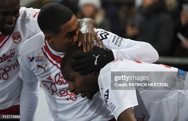 Bordeaux's Senegalese midfielder Younousse Sankhare celebrates with teammate Bordeaux's Brazilian forward Malcom after scoring a goal during the...