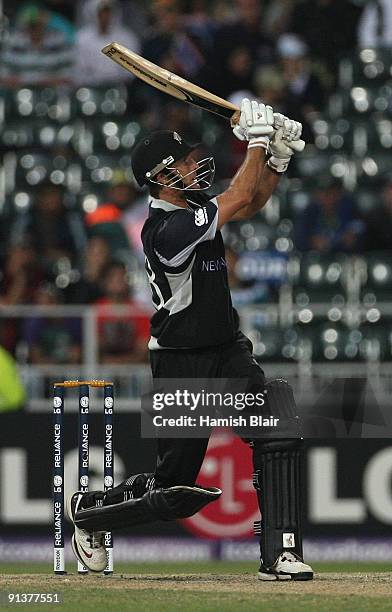 Grant Elliott of New Zealand hits a six over mid wicket during the ICC Champions Trophy 2nd Semi Final match between New Zealand and Pakistan played...
