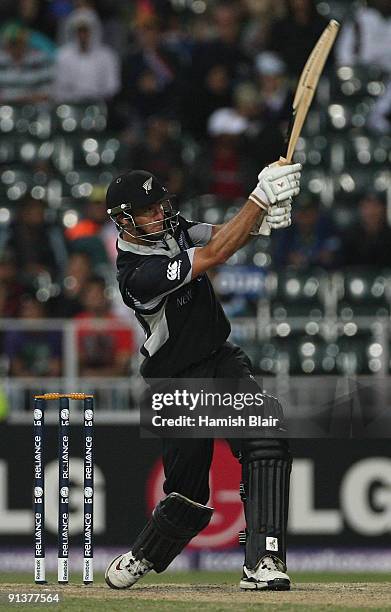 Grant Elliott of New Zealand hits a six over mid wicket during the ICC Champions Trophy 2nd Semi Final match between New Zealand and Pakistan played...