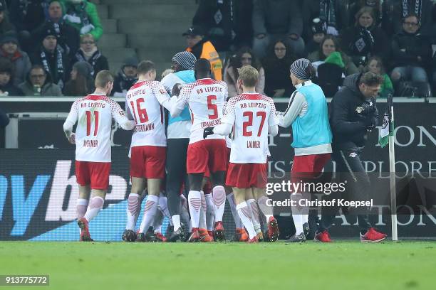 Ademola Lookman of Leipzig celebrates wit his team and coach Ralph Hasenhuettl of Leipzig after he scored a goal to make it 0:1 during the Bundesliga...