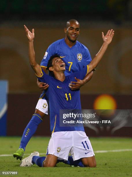 Paulo Henrique of Brazil celebrates with Alex Teixeira after scoring his goal during the FIFA U20 World Cup Group E match between Australia and...