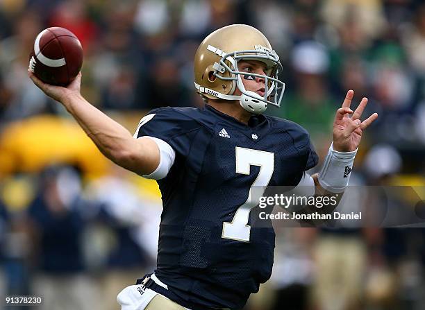 Jimmy Clausen of the Notre Dame Fighting Irish throws a pass against the Washington Huskies on October 3, 2009 at Notre Dame Stadium in South Bend,...