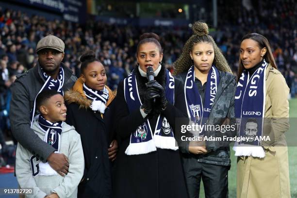 Julia Regis widow of Cyrille Regis with her family lead a thanks to the West Bromwich Albion Fans during the Premier League match between West...