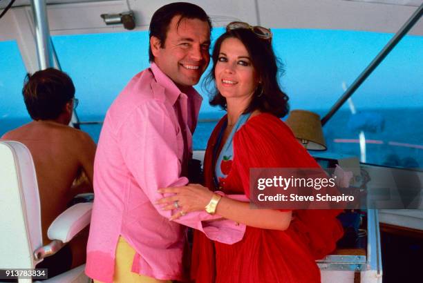 Portrait of married American actors Robert Wagner and Natalie Wood as they embrace on their yacht, the 'Splendour,' October 8, 1976.