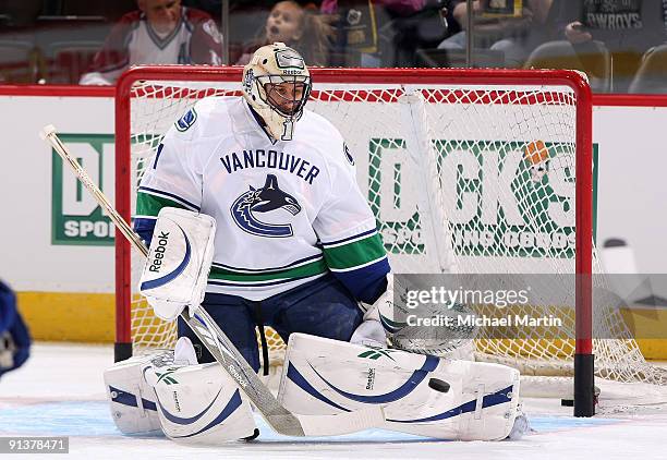 Goaltender Roberto Luongo of the Vancouver Canucks warms up prior to the game against the Colorado Avalanche at the Pepsi Center on October 3, 2009...
