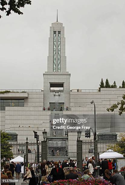 People mill around the Mormon Salt Lake temple waiting for the second session of the 179th Semi-Annual General Conference of the church on October 3,...