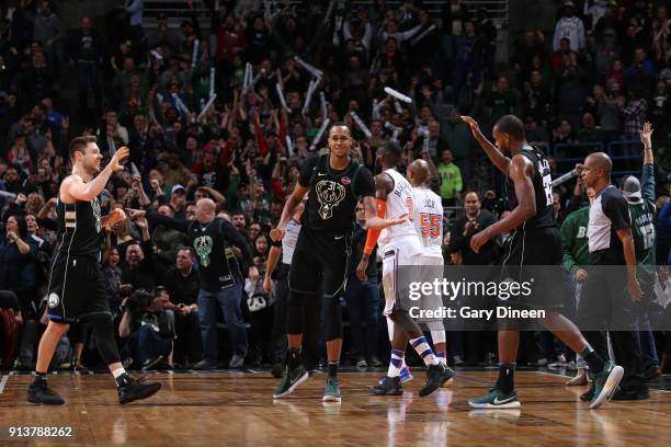 Milwaukee, WI Matthew Dellavedova John Henson and Khris Middleton of the Milwaukee Bucks exchange high fives during the game against the New York...