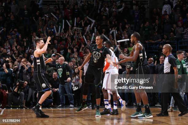 Milwaukee, WI Matthew Dellavedova John Henson and Khris Middleton of the Milwaukee Bucks exchange high fives during the game against the New York...