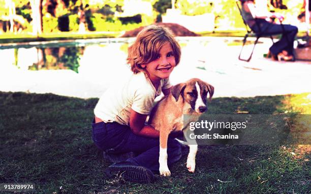 vintage photo of a girl with a dog outdoors - doggy pic stock pictures, royalty-free photos & images