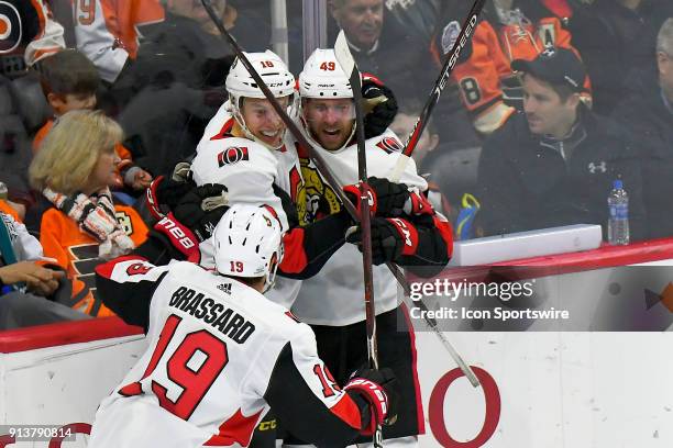 Ottawa Senators left wing Ryan Dzingel is congratulated by Ottawa Senators left wing Christopher DiDomenico and Ottawa Senators center Derick...