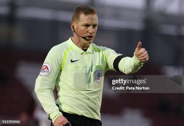 Referee John Busby in action wearing a black armband as a mark of respect to former referee Paul Alcock who passed away on January 18th 2018 during...