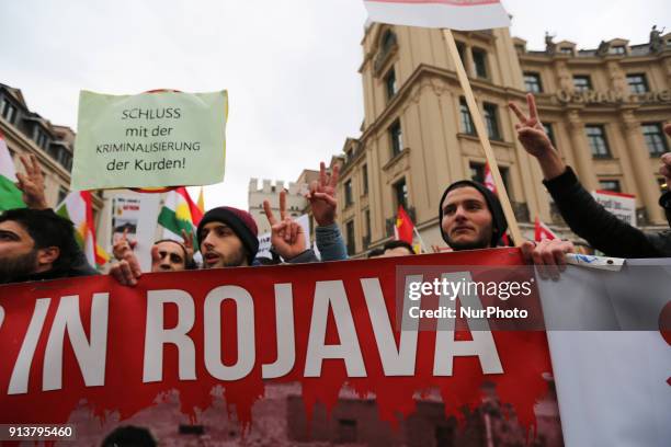 Activists showing the peace-sign. More than 1000 people joined the protest against the turkish bombing of the kurdish region in Syria Afrin, in...