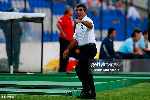 Head coach Carlos Reinoso of Queretaro gestures during a Mexican Apertura 2009 soccer match between Queretaro and Indios at the Corregidora Stadium...