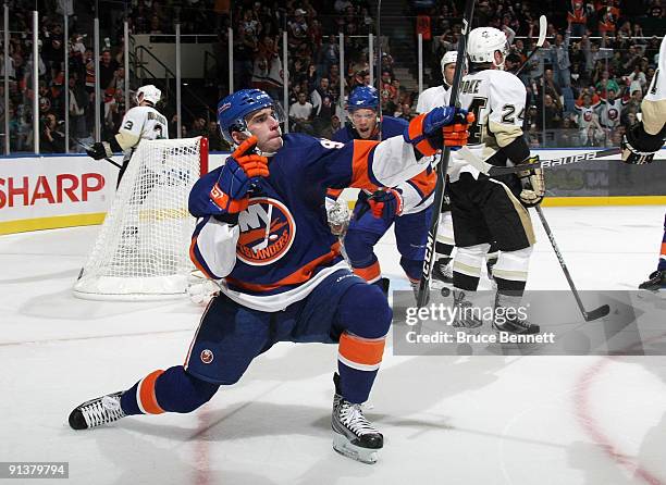 Playing in his first NHL game, John Tavares of the New York Islanders celebrates after scoring his first NHL goal against the Pittsburgh Penguins at...