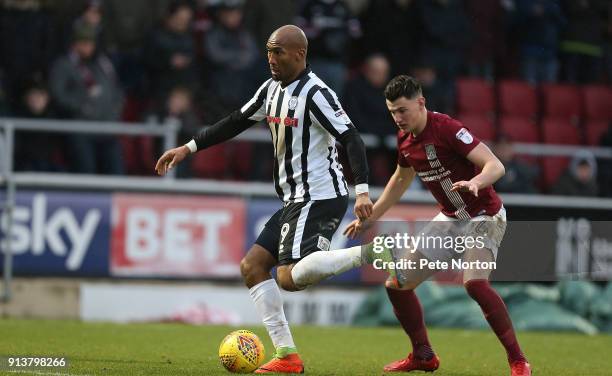 Calvin Andrew of Rochdale controls the ball watched by Regan Poole of Northampton Town during the Sky Bet League One match between Northampton Town...