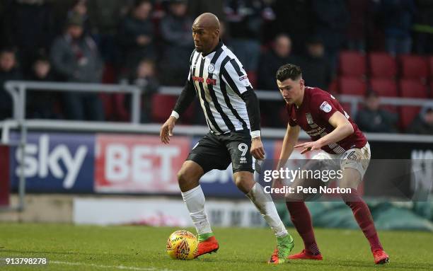 Calvin Andrew of Rochdale controls the ball watched by Regan Poole of Northampton Town during the Sky Bet League One match between Northampton Town...