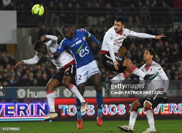 Strasbourg's Senegalese defender Kader Mangane vies with Bordeaux's Senegalese midfielder Younousse Sankhare and Bordeaux's French forward Gaetan...