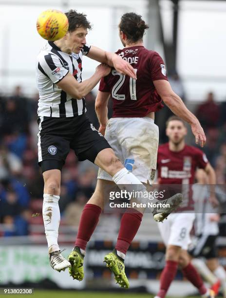 Jim McNulty of Rochdale contests the ball with John-Joe O'Toole of Northampton Town during the Sky Bet League One match between Northampton Town and...