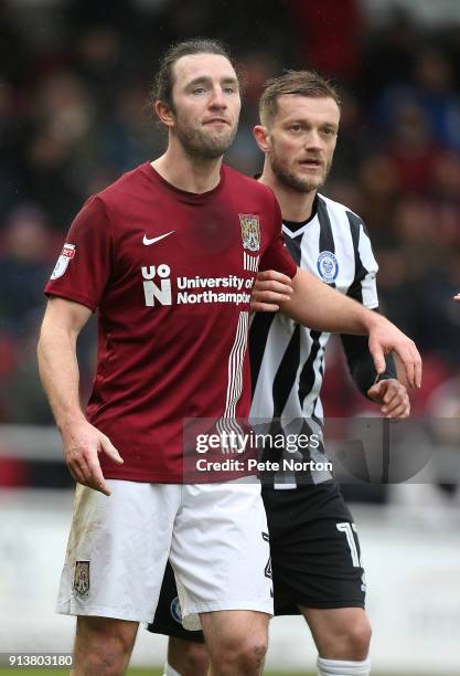 John-Joe O'Toole of NorthamptonTown and Scott Wiseman of Rochdale in action during the Sky Bet League One match between Northampton Town and Rochdale...