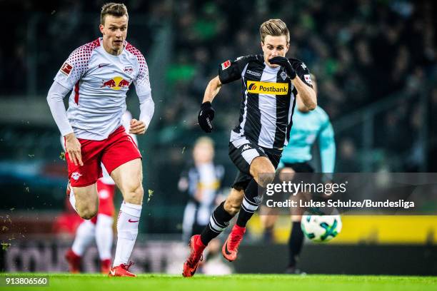 Lukas Klostermann of Leipzig and Patrick Herrmann of Moenchengladbach in action during the Bundesliga match between Borussia Moenchengladbach and RB...