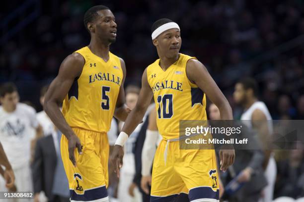 Tony Washington and Isiah Deas of the La Salle Explorers look on against the Villanova Wildcats at the Wells Fargo Center on December 10, 2017 in...