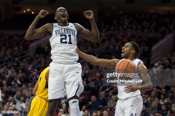 Dhamir Cosby-Roundtree and Phil Booth of the Villanova Wildcats react against the La Salle Explorers at the Wells Fargo Center on December 10, 2017...