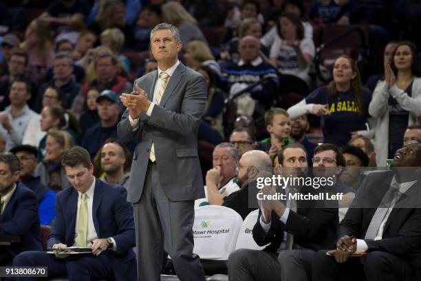 Head coach Dr. John Giannini of the La Salle Explorers claps against the Villanova Wildcats at the Wells Fargo Center on December 10, 2017 in...