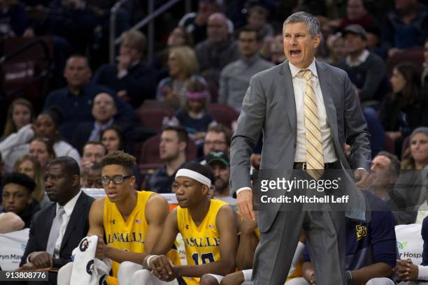 Head coach Dr. John Giannini of the La Salle Explorers yells out to his team against the Villanova Wildcats at the Wells Fargo Center on December 10,...