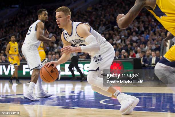 Donte DiVincenzo of the Villanova Wildcats dribbles the ball against the La Salle Explorers at the Wells Fargo Center on December 10, 2017 in...