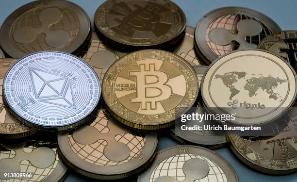 Symbol photo on the topics cryptocurrency, digital currency, Speculation, currency speculation, etc. The picture shows Ethereum, Bitcoin and Ripple...