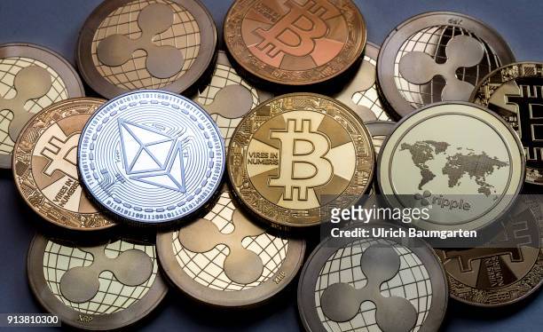 Symbol photo on the topics cryptocurrency, digital currency, Speculation, currency speculation, etc. The picture shows Ethereum, Bitcoin and Ripple...